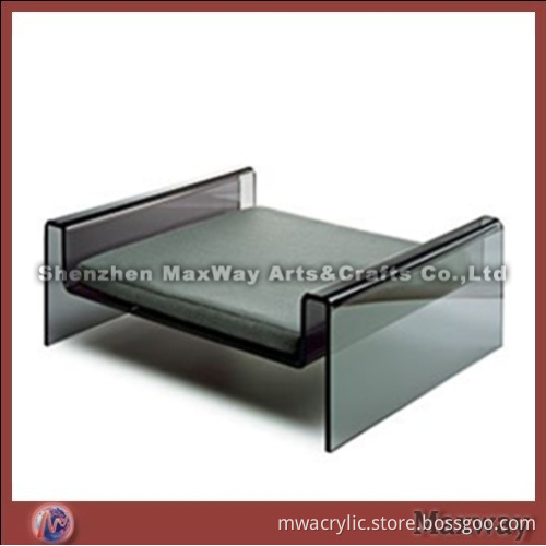 M-shaped dark lucite/acrylic pet/dog bed with gray cushion